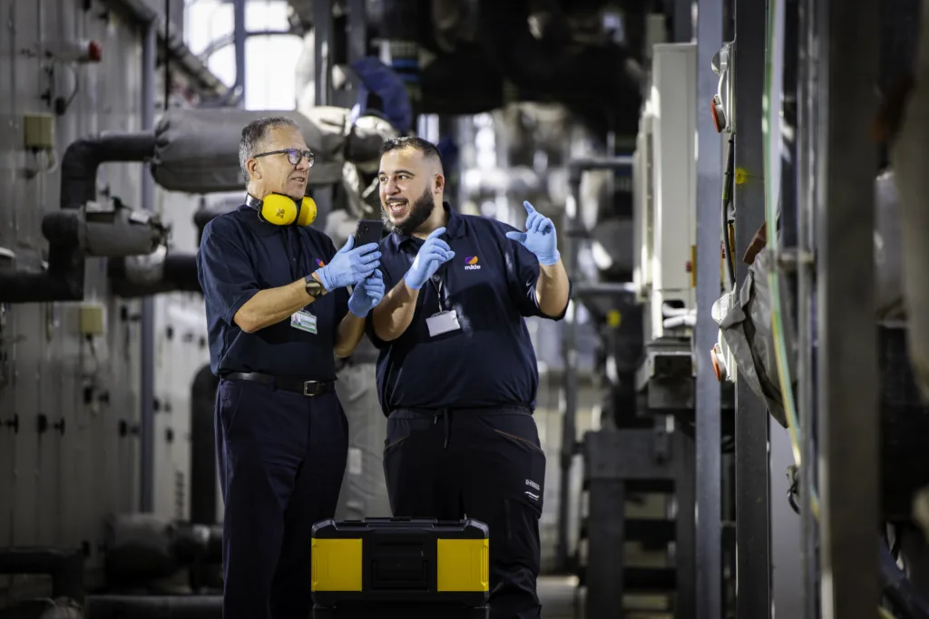 Two Mitie engineers in a plant room