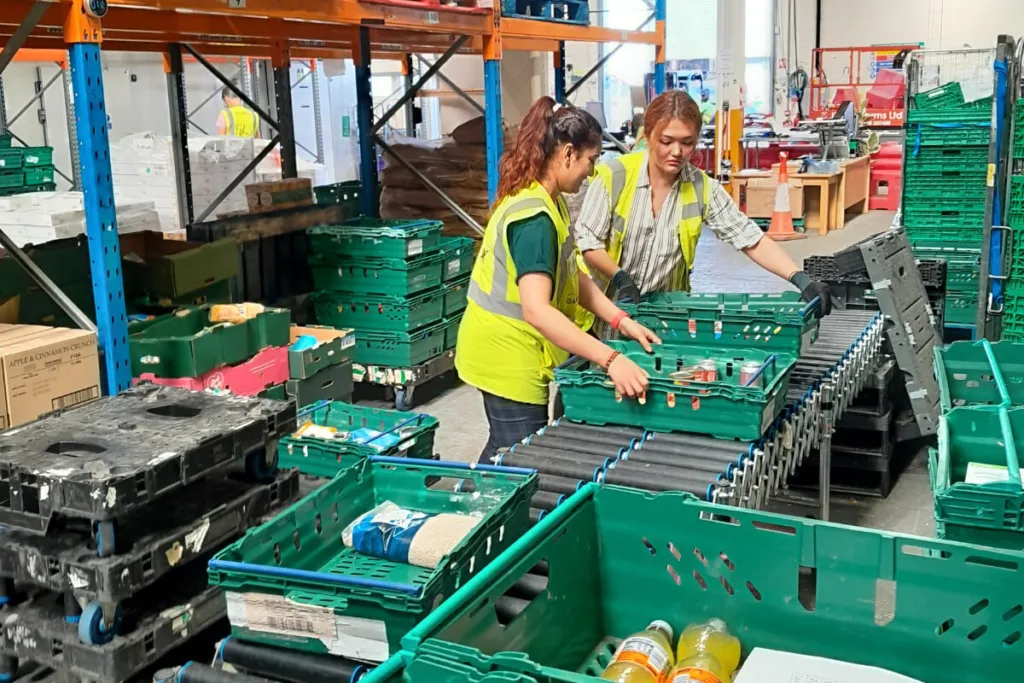 Two women volunteering at a food bank