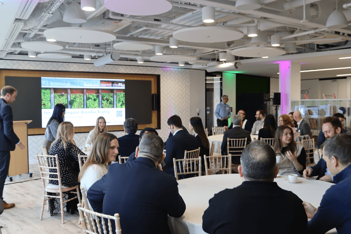 Crowd watching presentation at Net Zero Navigator breakfast