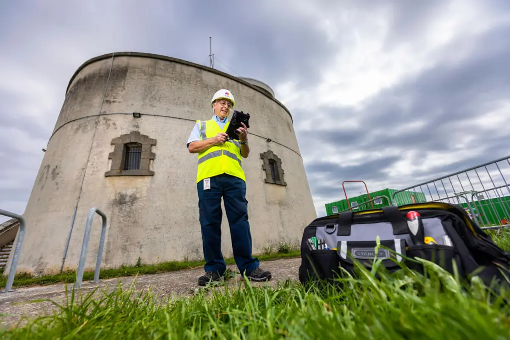 A Mitie engineer by Martello Tower in Essex
