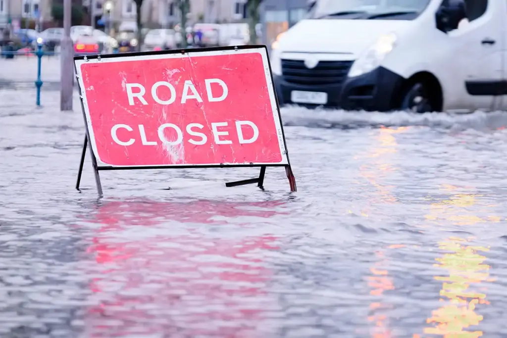 Flooding with 'Road closed' sign