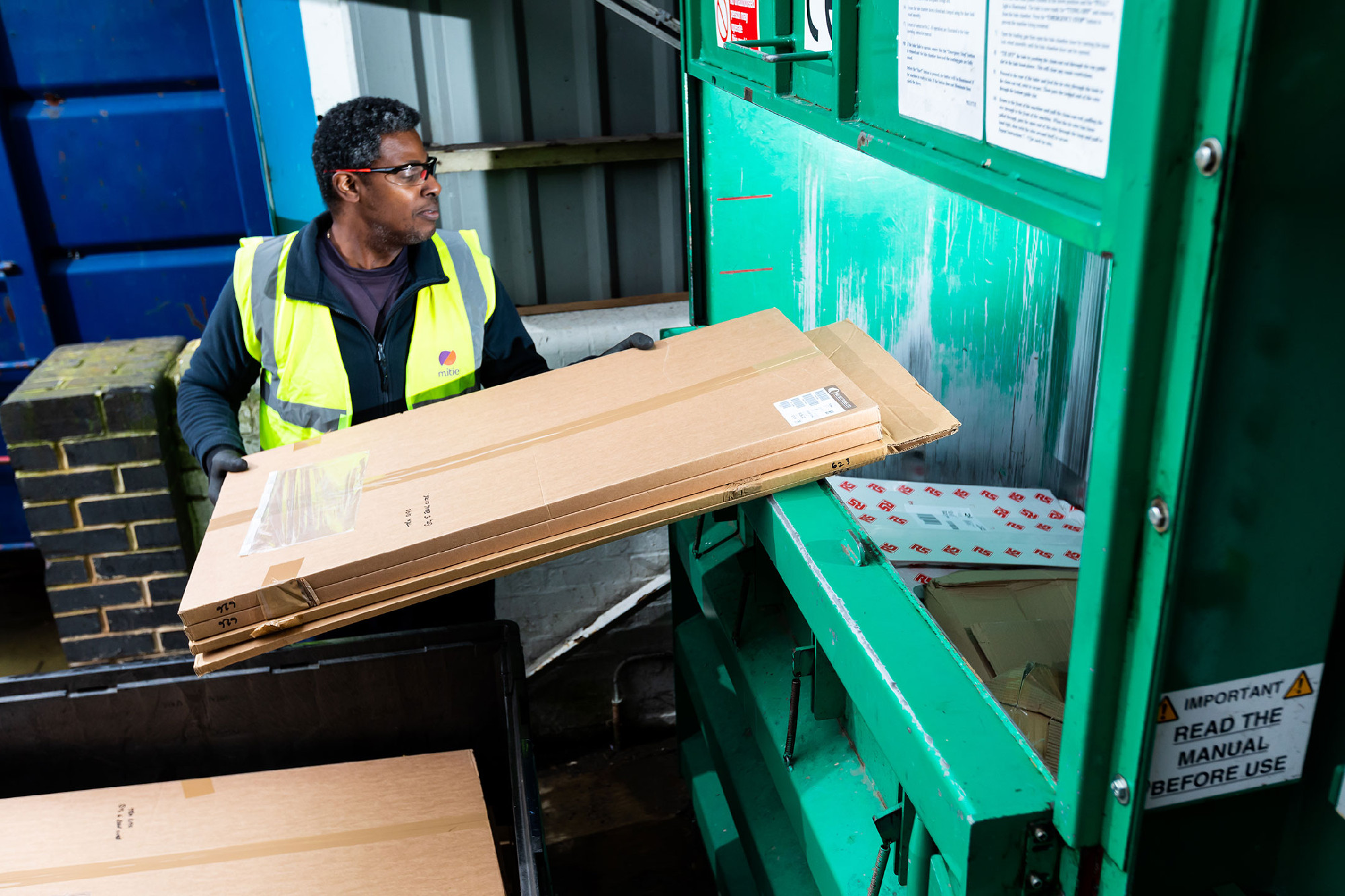 Mitie worker disposing of waste.