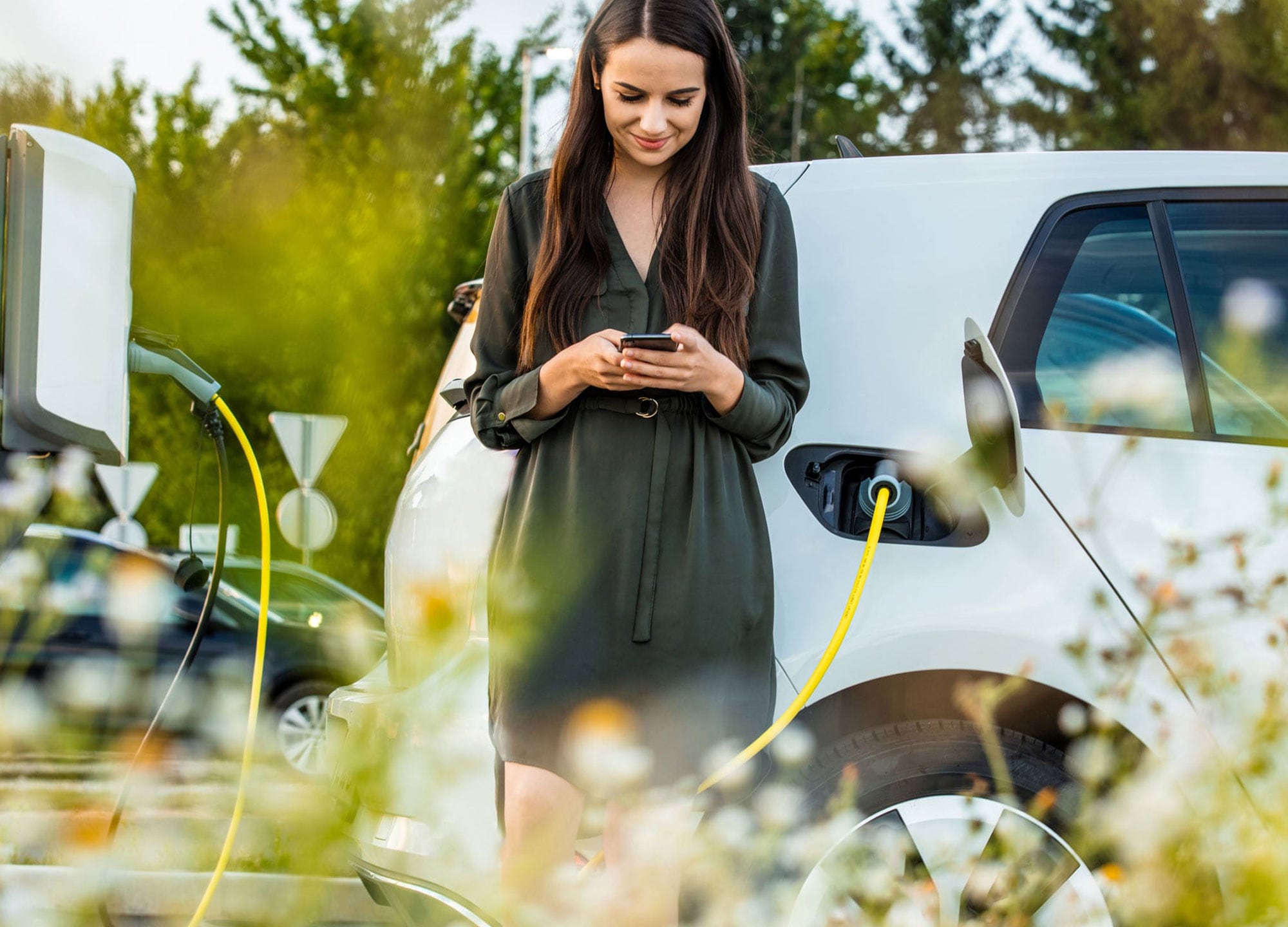 Woman charging an electric car.