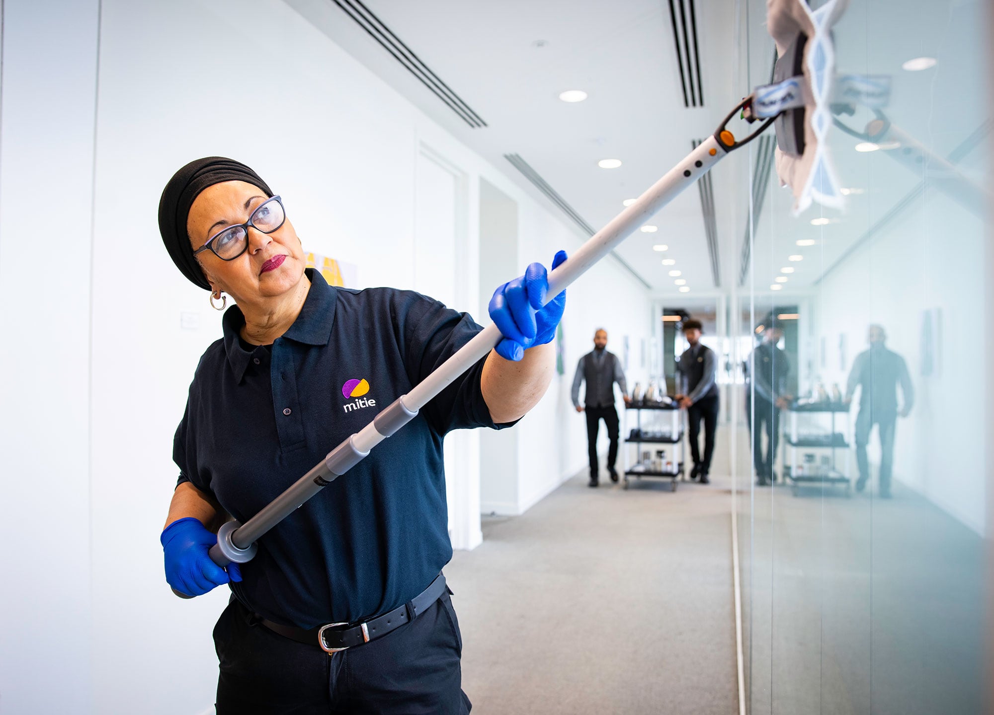 Mitie colleague cleaning.