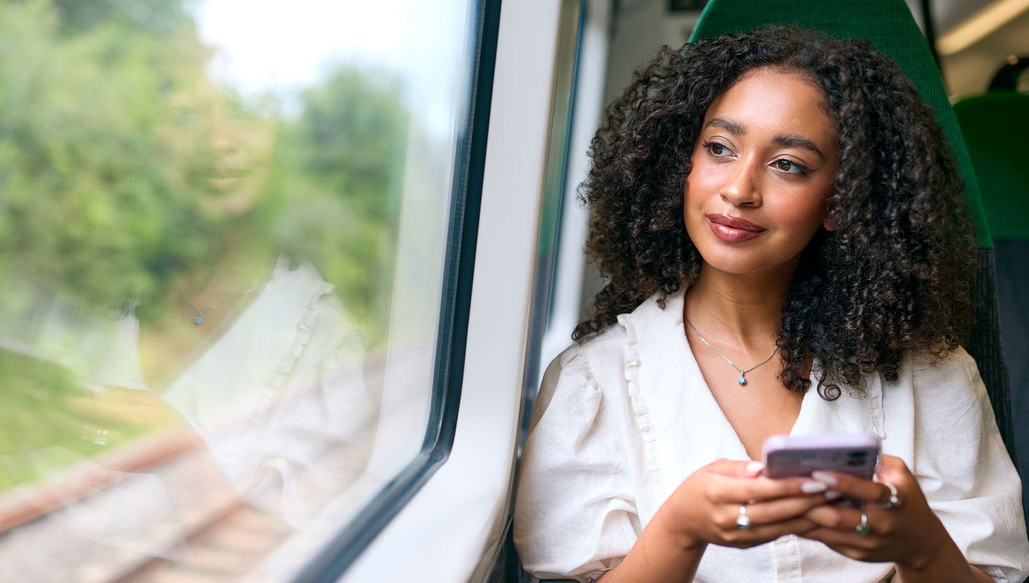 Woman commuter on train.