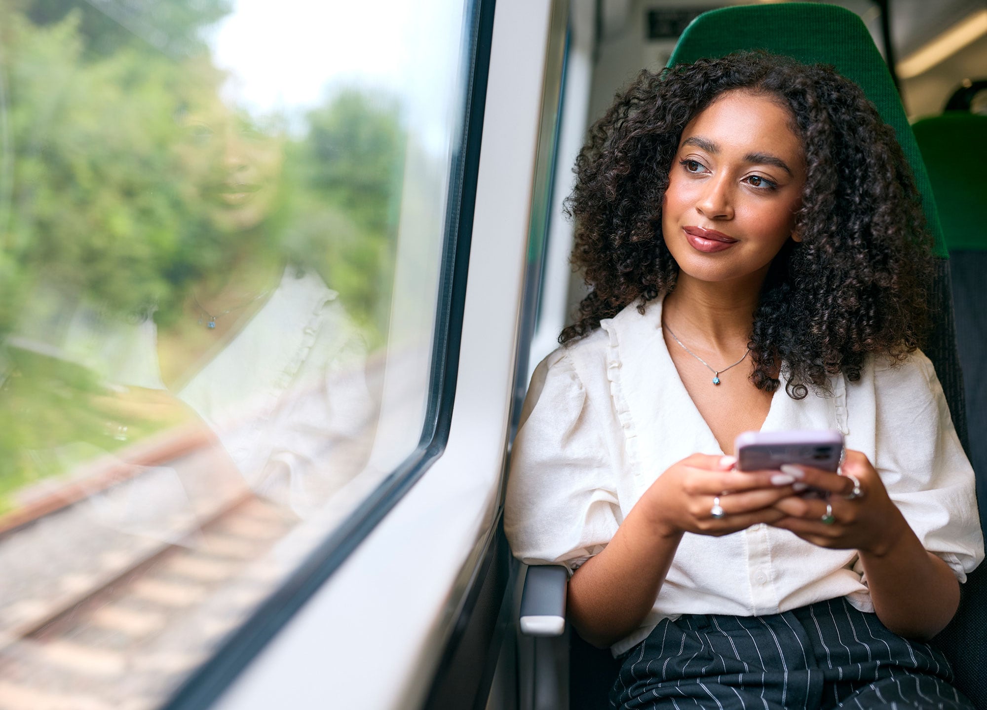Woman travelling on train.
