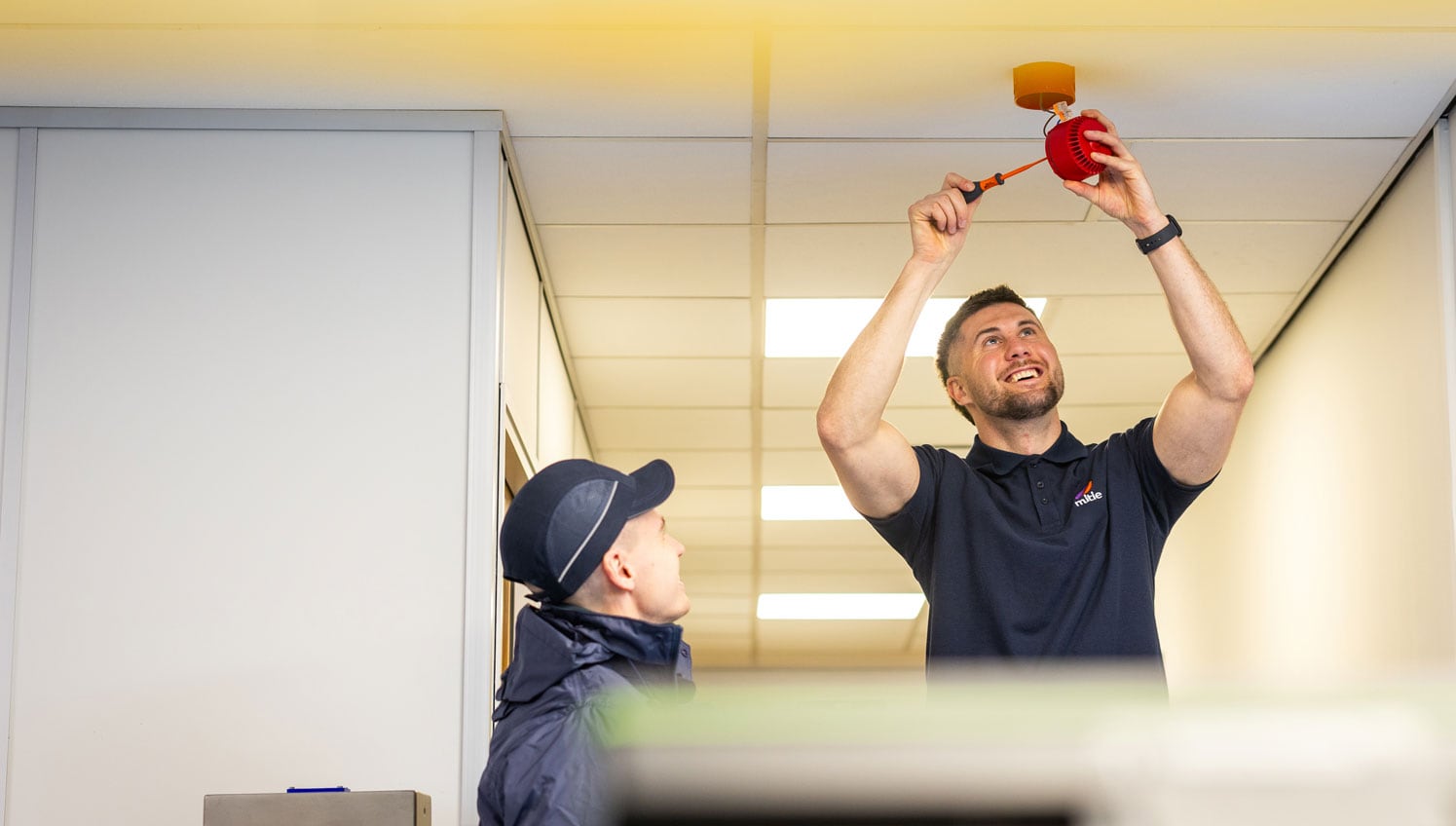 Fire safety installation with Mitie colleagues.