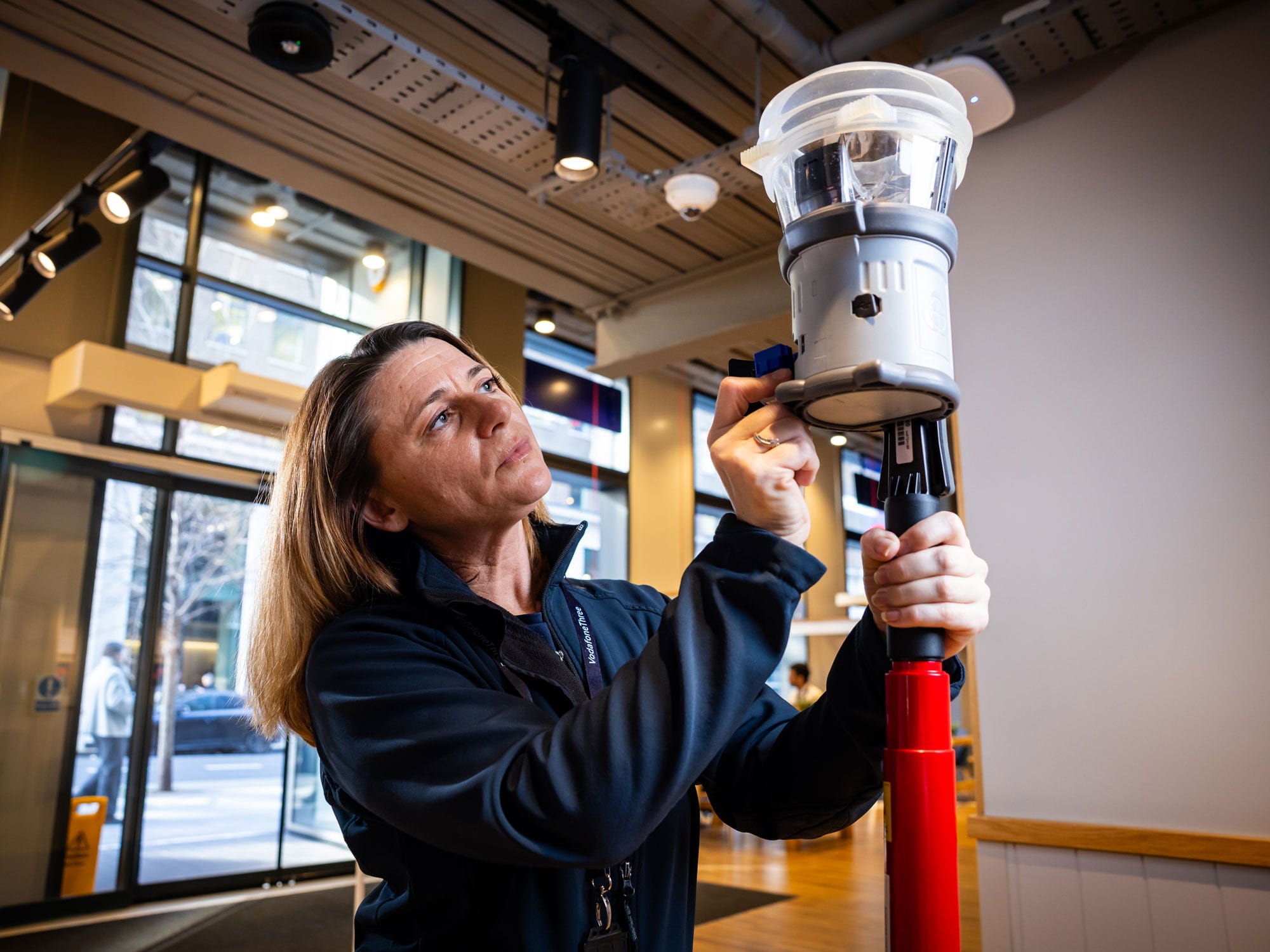 Woman with fire testing equipment.