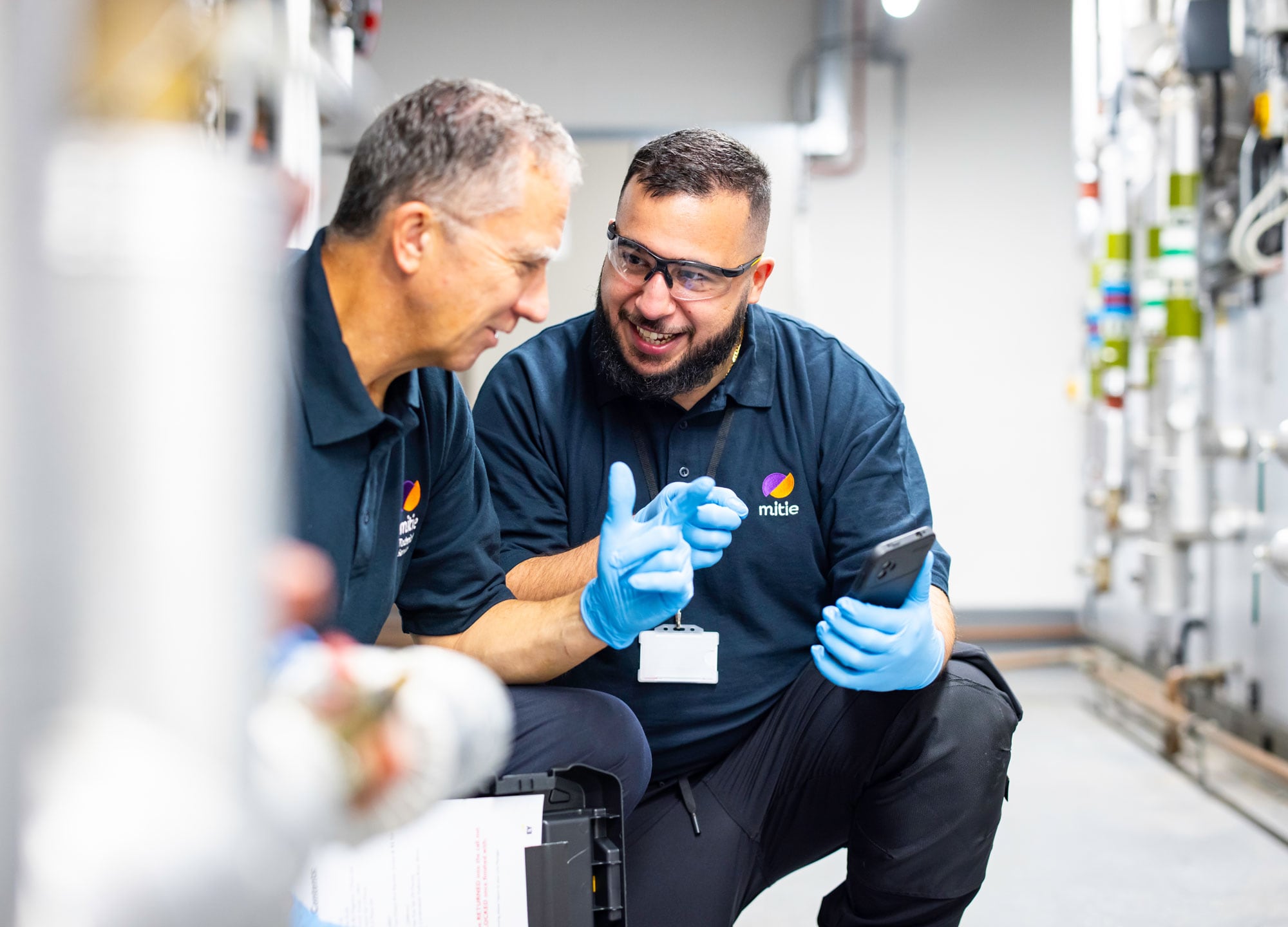 Mitie colleagues talking to each other.