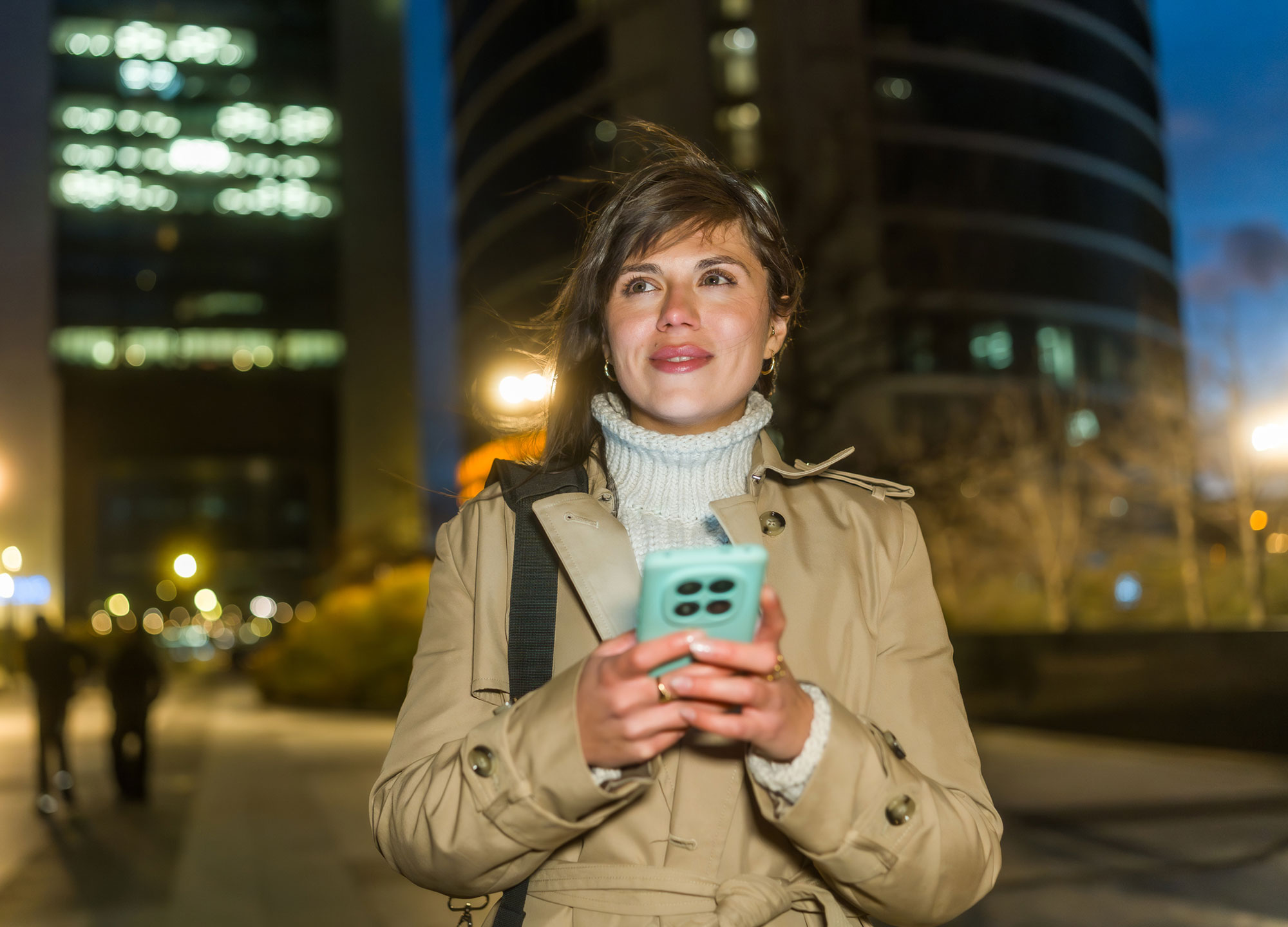 Girl at night in street.