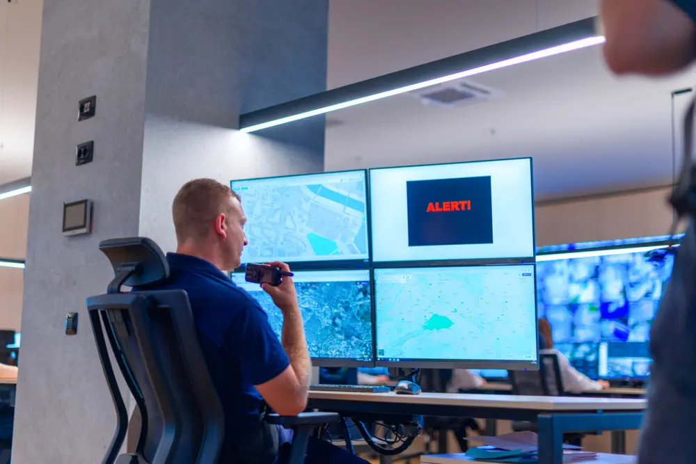 Security officer reviewing CCTV screens